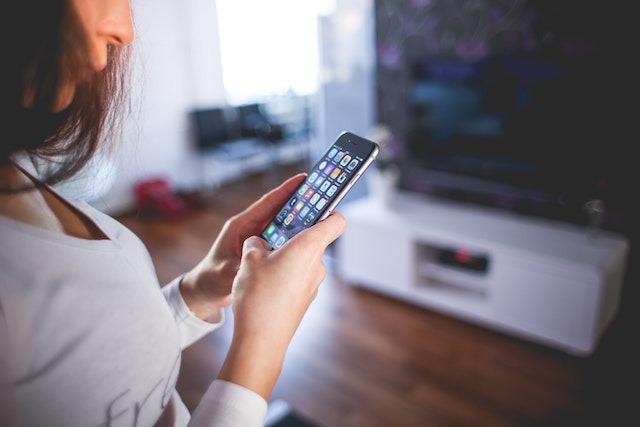 person using a smartphone indoors