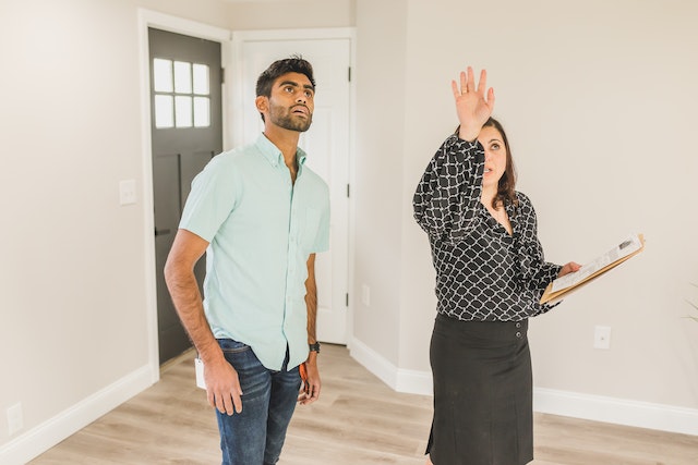 someone showing a rental unit to someone else