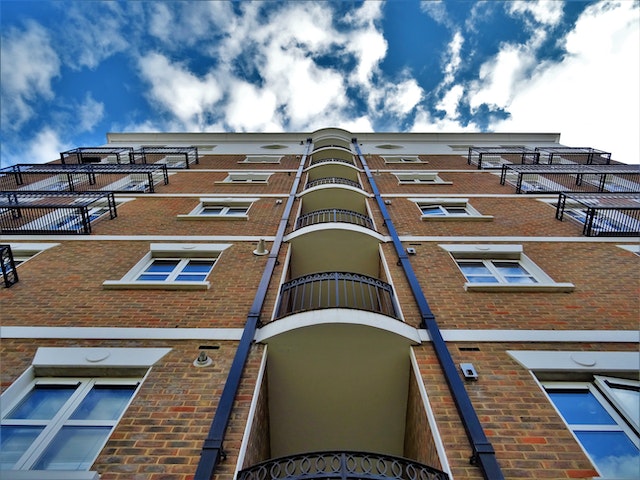 a multifamily brick building at a low angle