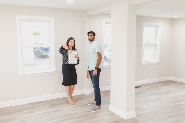 two people looking at a new property