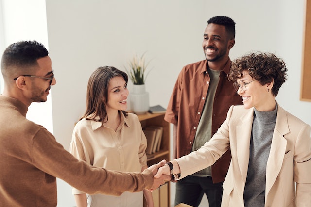 a group of people shaking hands