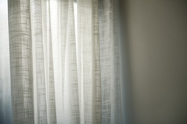 faded white curtains