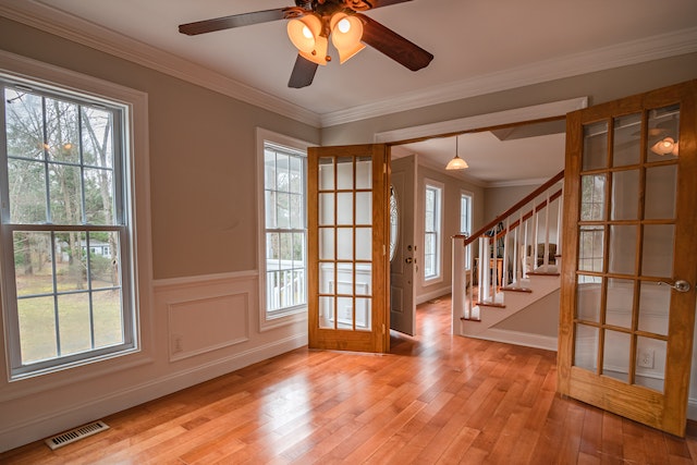 the interior of a house with wood floors and lots of windows