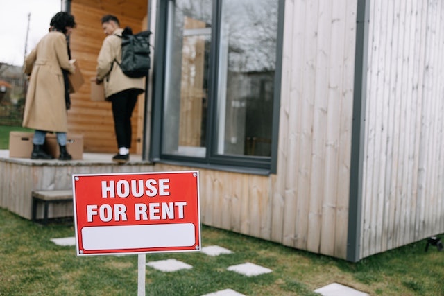 two people walking into a house for rent