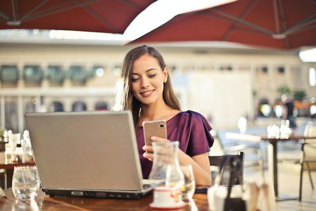 a person working on a laptop at a restaurant