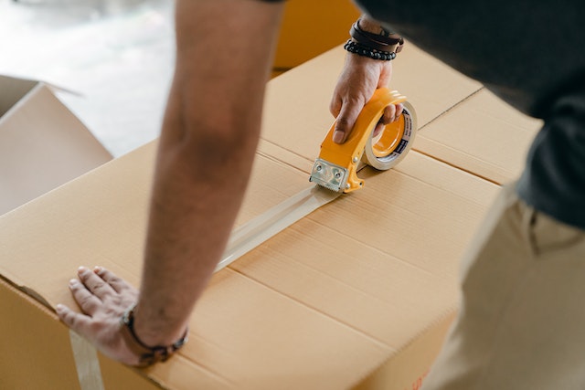 taping a cardboard box shut